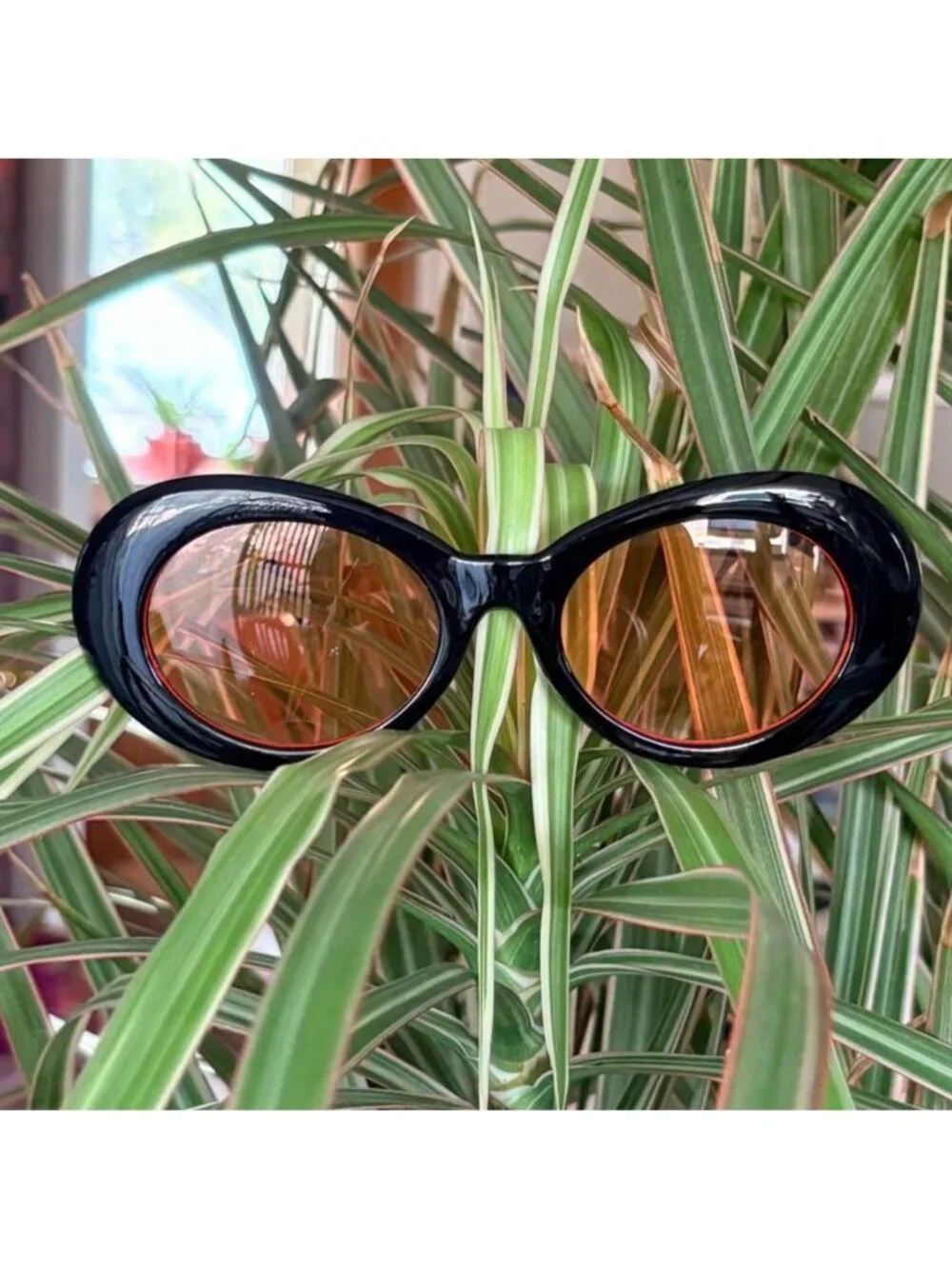 black clout goggles with orange tint
